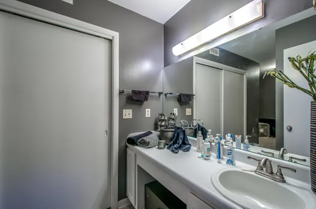 a bed room with a bed and a bookshelf