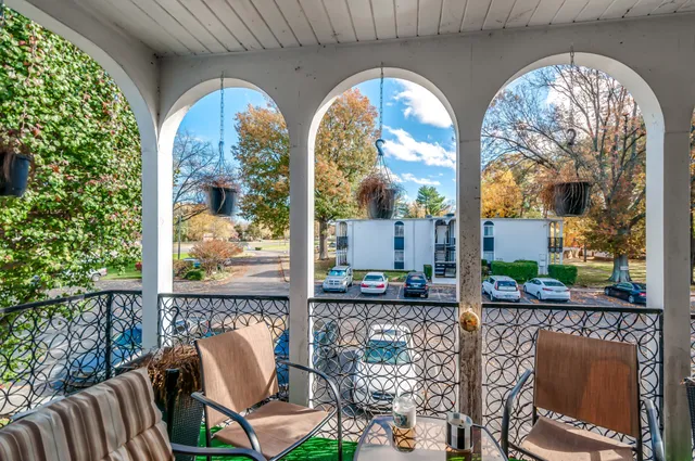 a view of hall way with furniture