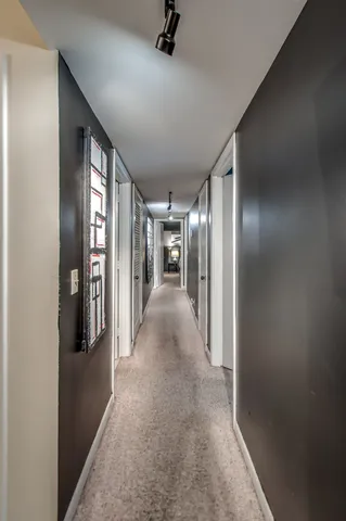 a bedroom with furniture and a large window