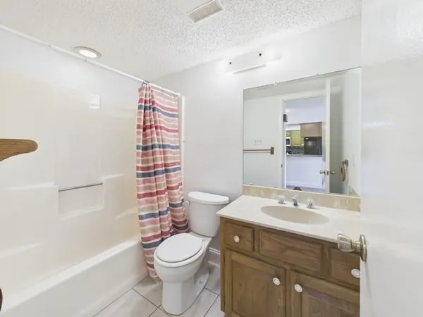 a bathroom with a bathtub and shower