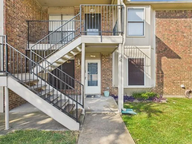 a view of house with outdoor space and window