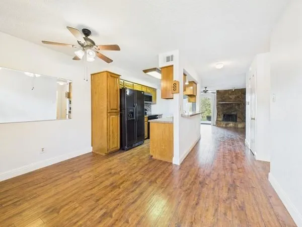 a kitchen with stainless steel appliances granite countertop a sink and a stove