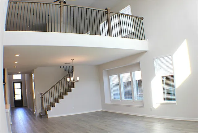 a view of entryway with stairs and wooden floor
