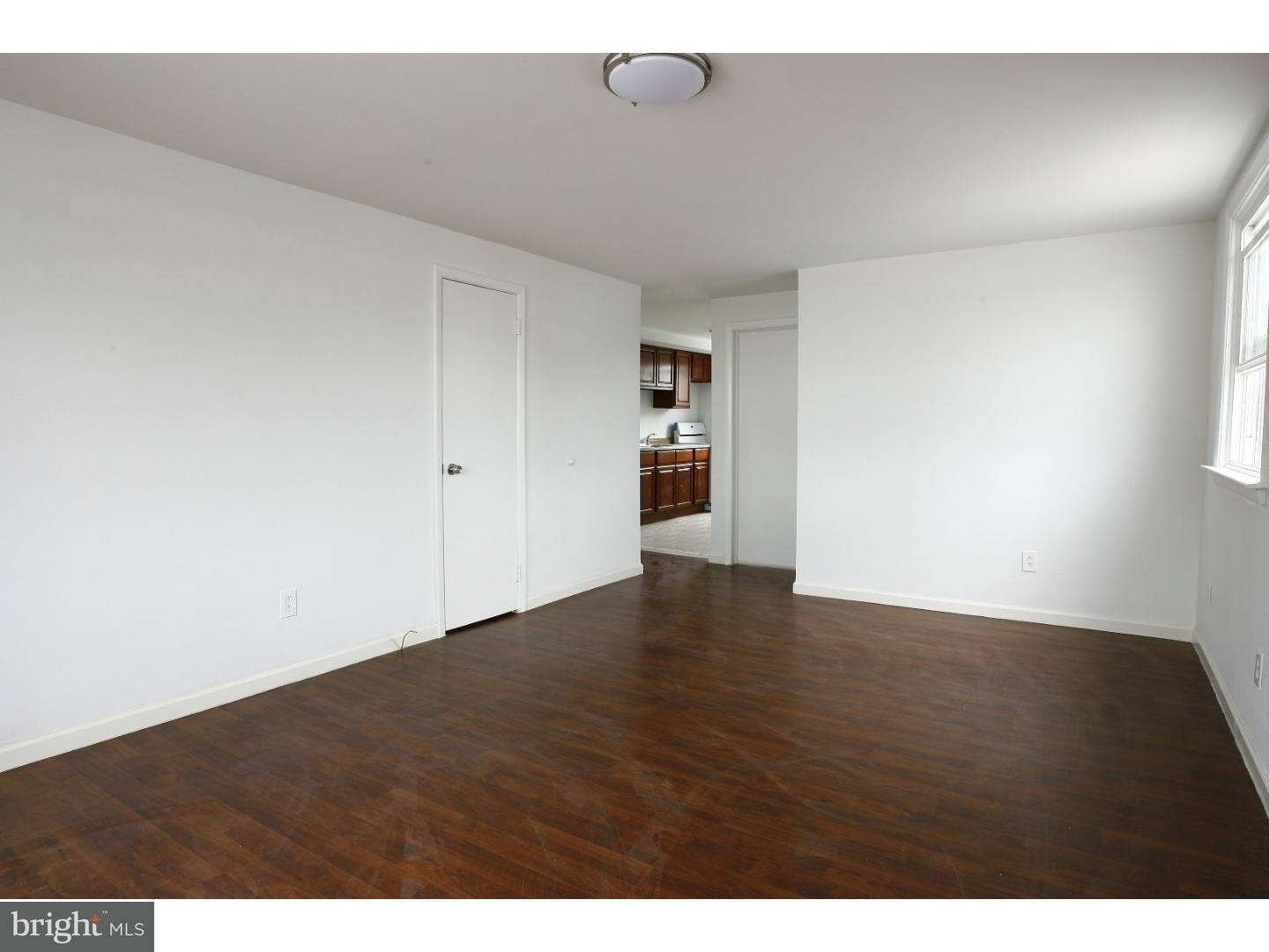 7136 Clinton Road Upper Darby, PA 19082 - Photo 3 of 10 a view of an empty room with wooden floor