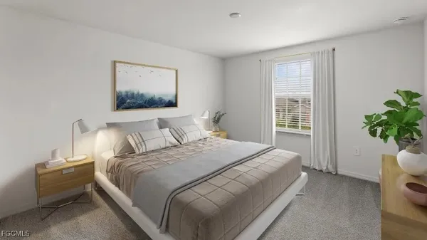 a bedroom with a bed and a potted plant