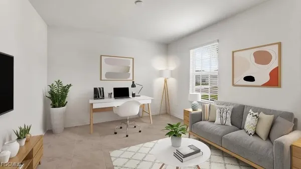 a living room with furniture and a potted plant