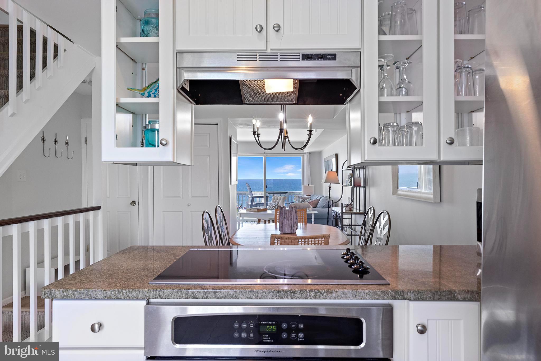 1 Centre Street, Unit 1 Beach Haven, NJ 08008 - Photo 13 of 40 a kitchen with stainless steel appliances granite countertop a stove and a sink