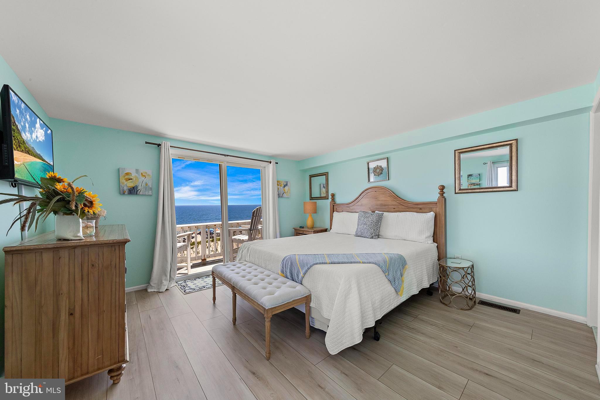 1 Centre Street, Unit 1 Beach Haven, NJ 08008 - Photo 17 of 40 a bedroom with a bed and a wooden floor