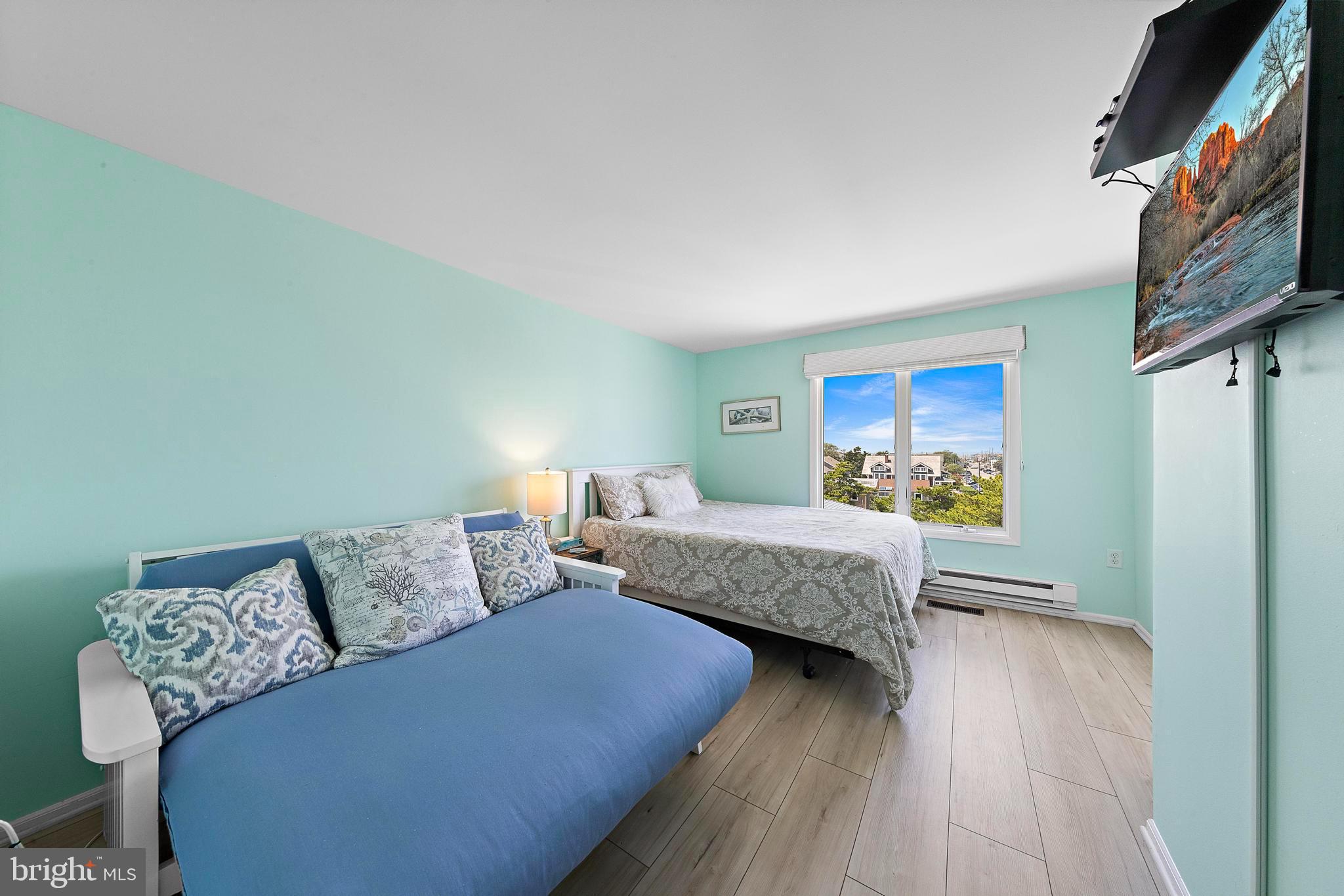 1 Centre Street, Unit 1 Beach Haven, NJ 08008 - Photo 20 of 40 a bedroom with furniture and a wooden floor