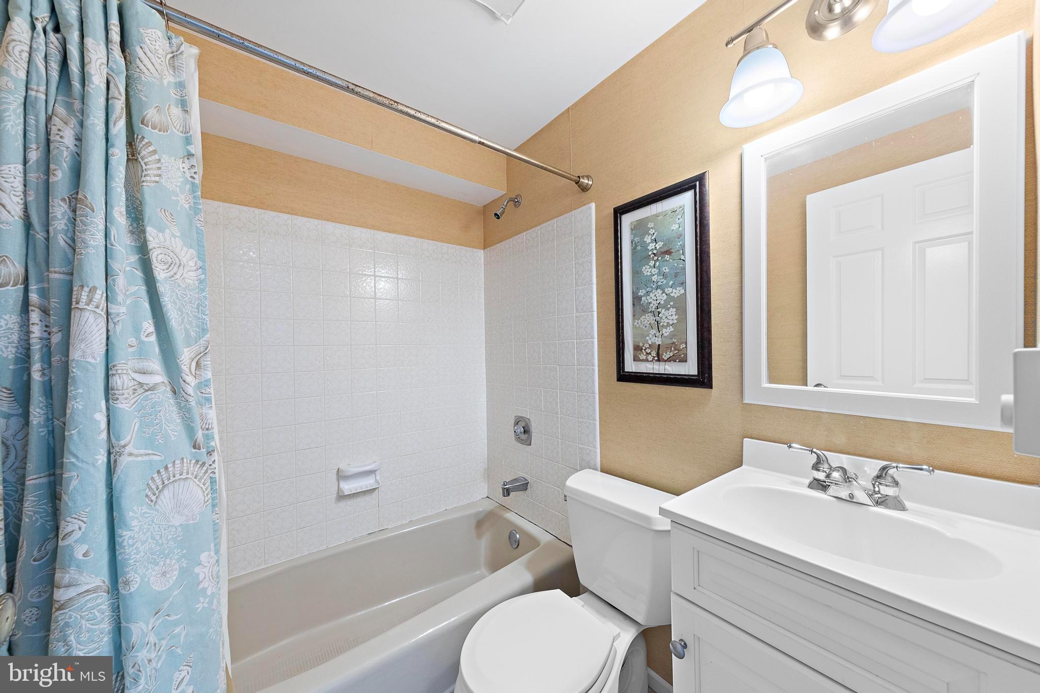 1 Centre Street, Unit 1 Beach Haven, NJ 08008 - Photo 21 of 40 a bathroom with a sink toilet and shower