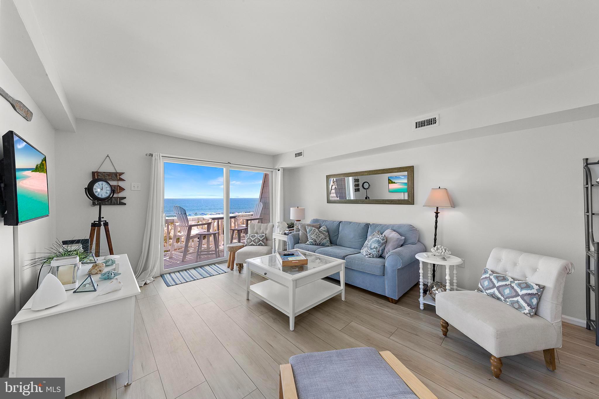 1 Centre Street, Unit 1 Beach Haven, NJ 08008 - Photo 29 of 40 a living room with furniture and a flat screen tv