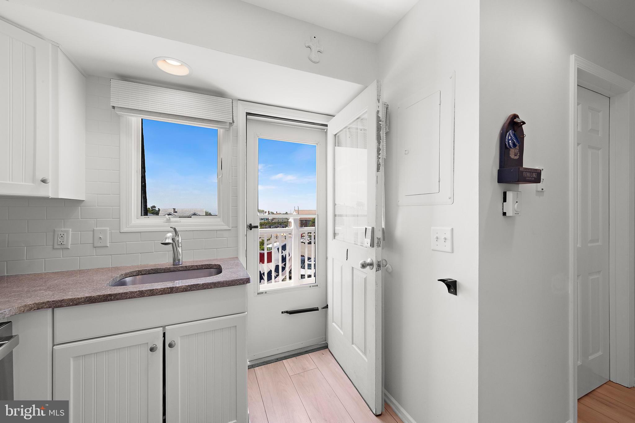 1 Centre Street, Unit 1 Beach Haven, NJ 08008 - Photo 31 of 40 a kitchen with a sink and cabinets