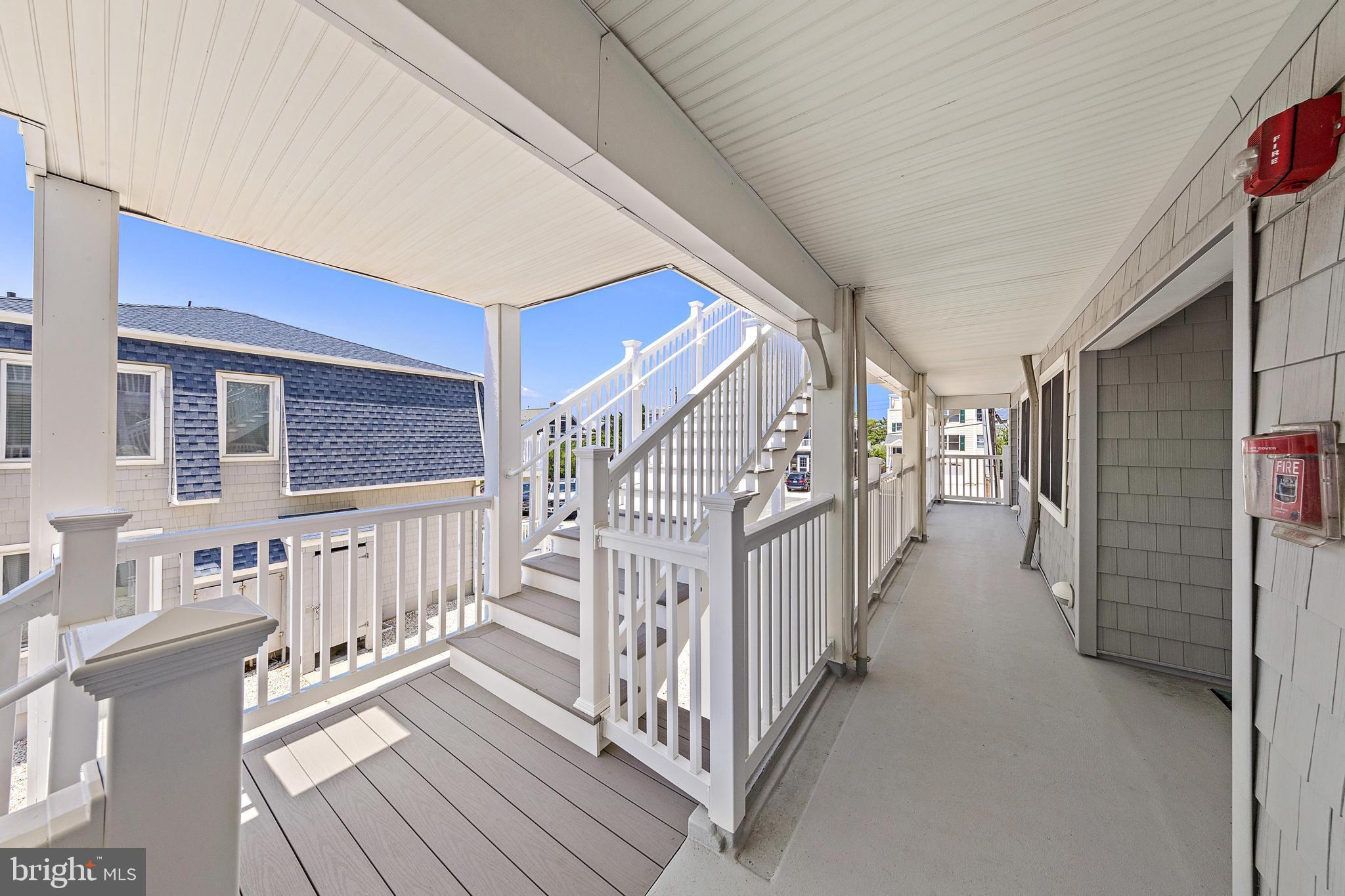 1 Centre Street, Unit 1 Beach Haven, NJ 08008 - Photo 38 of 40 a view of a porch with wooden floor and stairs