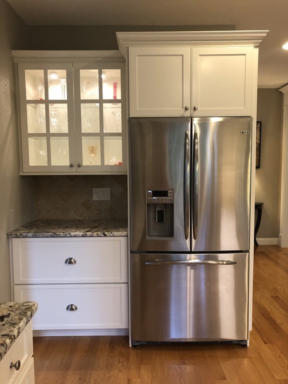 6 Adams Farm Road, Unit 6 Shrewsbury, MA 01545 - Photo 13 of 38 a kitchen with granite countertop a refrigerator and a stove