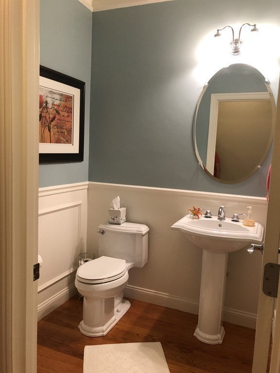 6 Adams Farm Road, Unit 6 Shrewsbury, MA 01545 - Photo 18 of 38 a bathroom with a toilet sink and mirror