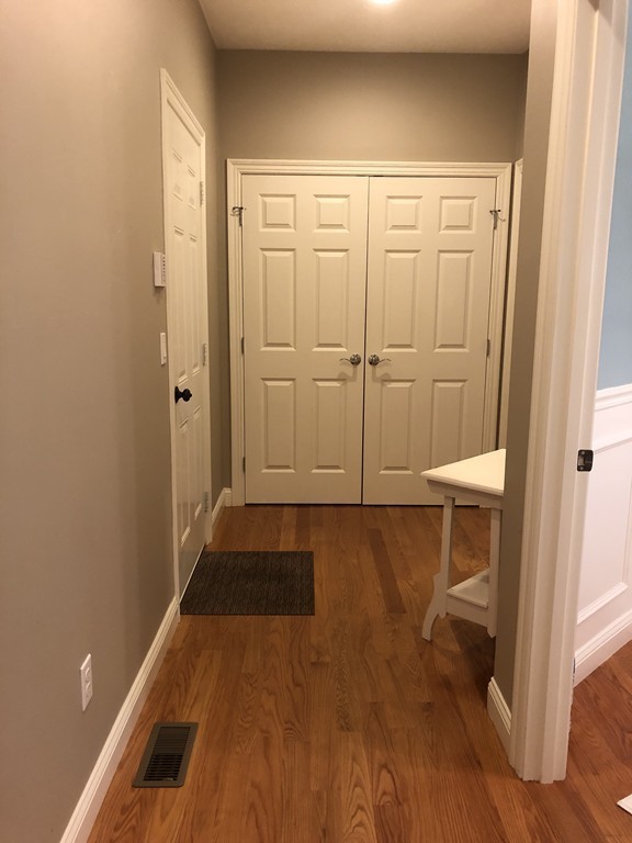 6 Adams Farm Road, Unit 6 Shrewsbury, MA 01545 - Photo 19 of 38 a view of a room with wooden floor and white walls