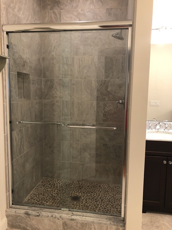 6 Adams Farm Road, Unit 6 Shrewsbury, MA 01545 - Photo 24 of 38 a bathroom with a shower and a sink