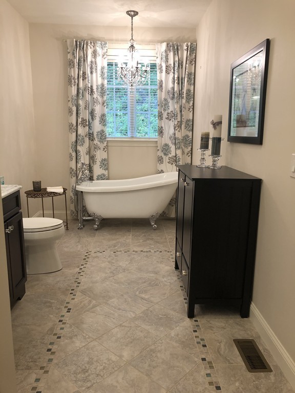 6 Adams Farm Road, Unit 6 Shrewsbury, MA 01545 - Photo 25 of 38 a bathroom with a bathtub and shower
