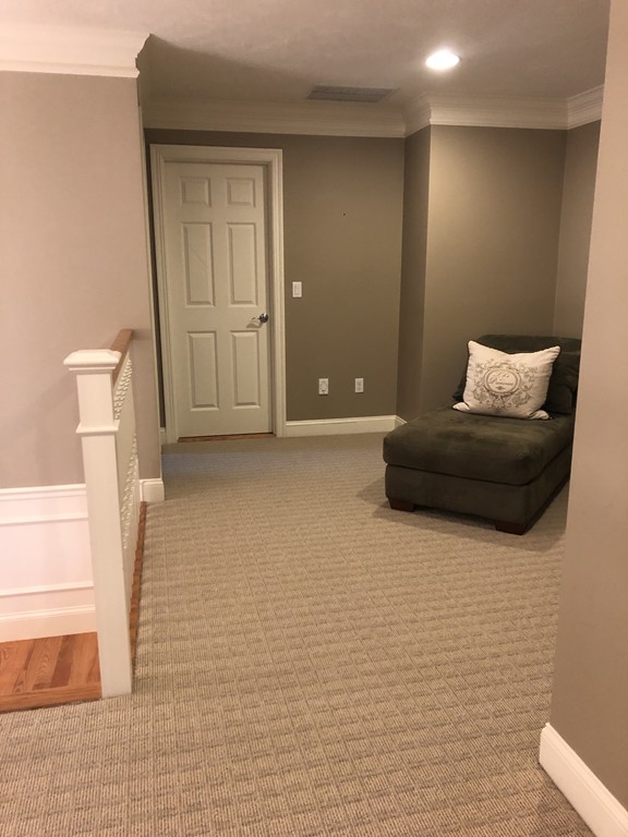 6 Adams Farm Road, Unit 6 Shrewsbury, MA 01545 - Photo 31 of 38 a living room with a couch and a table