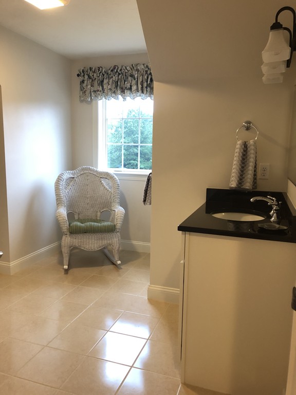 6 Adams Farm Road, Unit 6 Shrewsbury, MA 01545 - Photo 32 of 38 a living room with furniture and a window