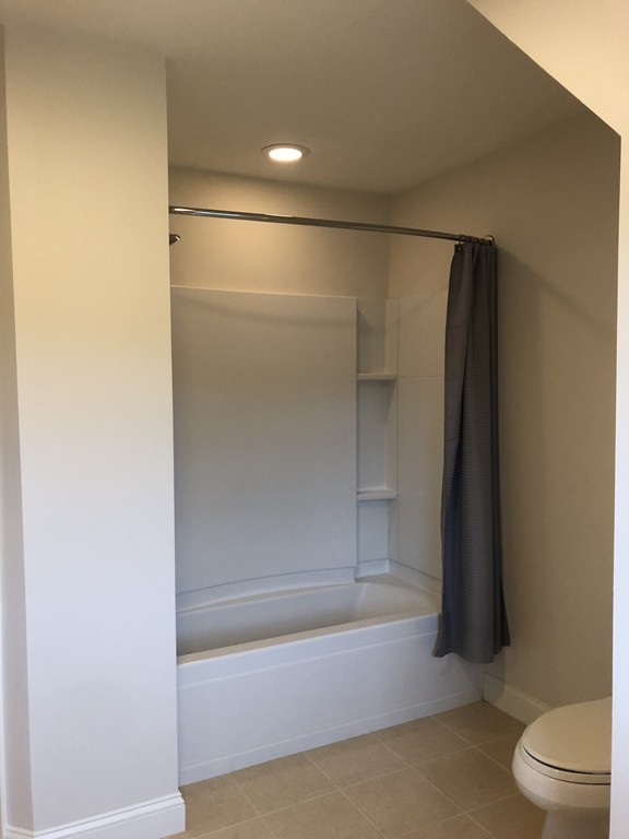 6 Adams Farm Road, Unit 6 Shrewsbury, MA 01545 - Photo 33 of 38 a bathroom with a shower and a toilet