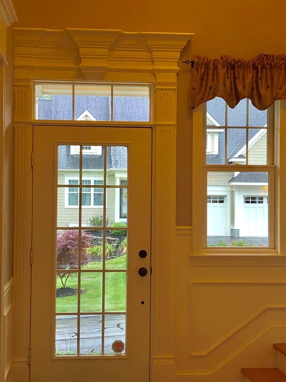 6 Adams Farm Road, Unit 6 Shrewsbury, MA 01545 - Photo 4 of 38 a front view of a house with a large window