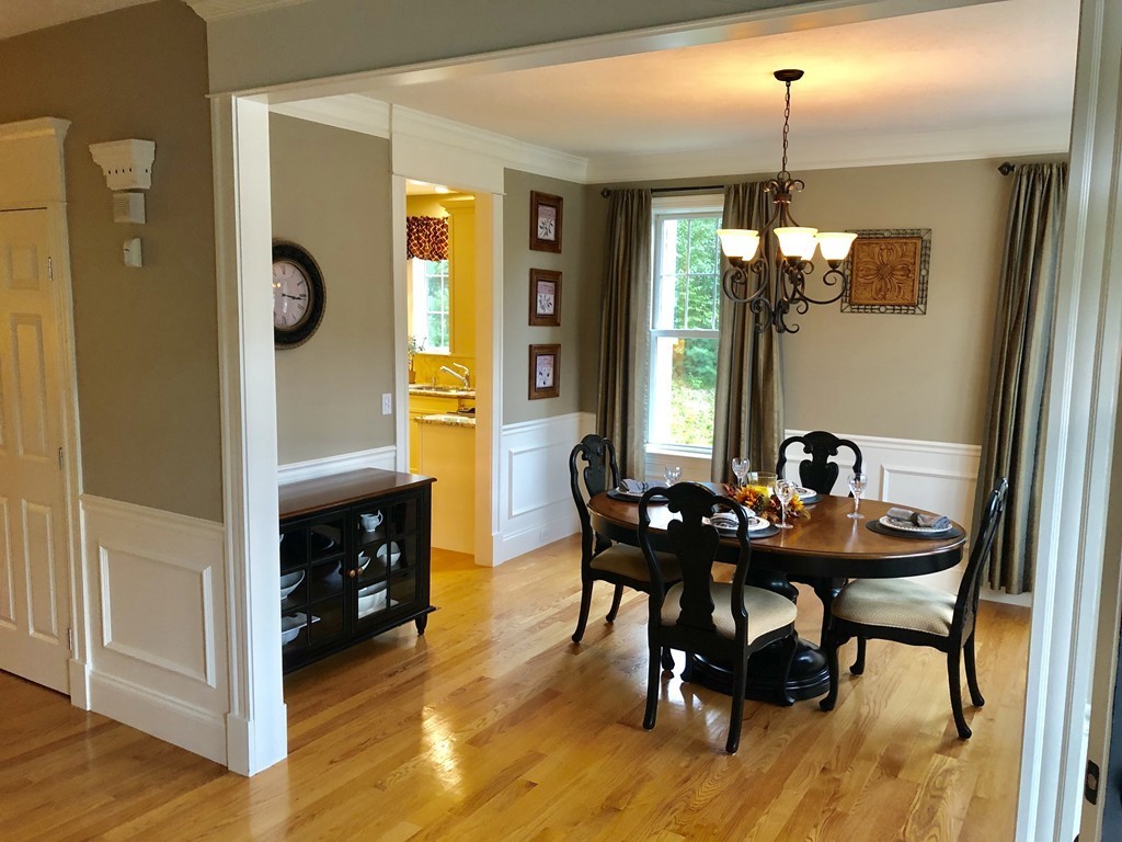 6 Adams Farm Road, Unit 6 Shrewsbury, MA 01545 - Photo 8 of 38 a view of a dining room with furniture and chandelier