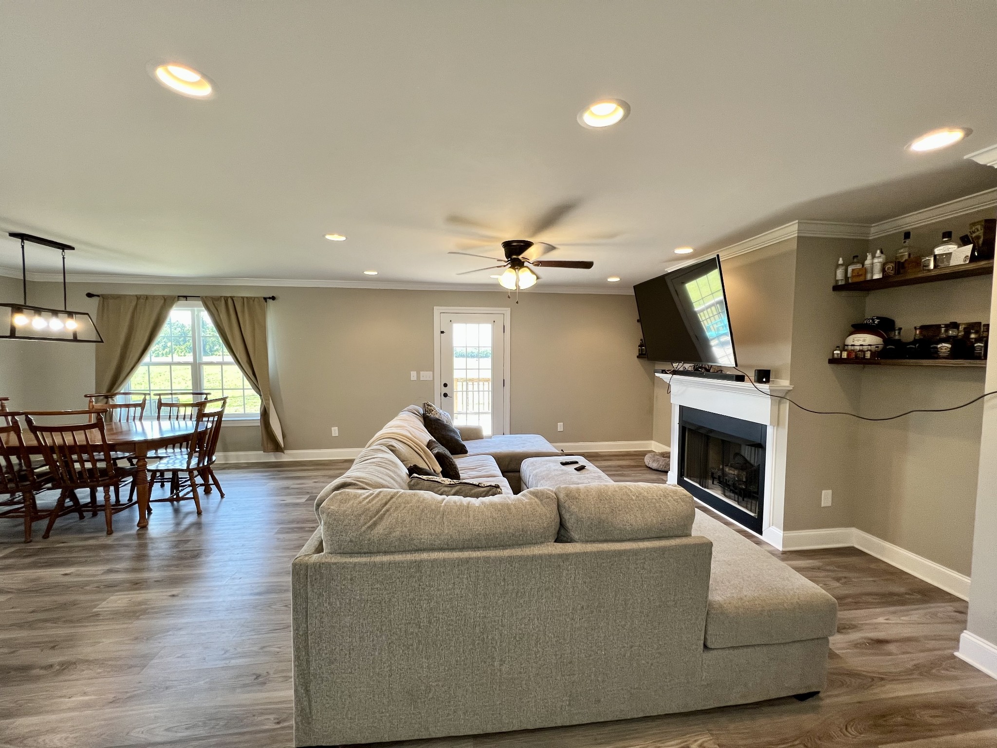 418 Taylor Road Manchester, TN 37355 - Photo 13 of 30 a living room with furniture a fireplace and a flat screen tv