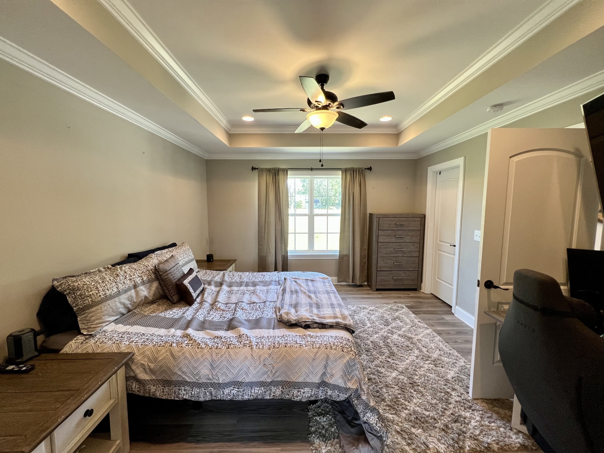 418 Taylor Road Manchester, TN 37355 - Photo 14 of 30 a bedroom with a bed and a chandelier