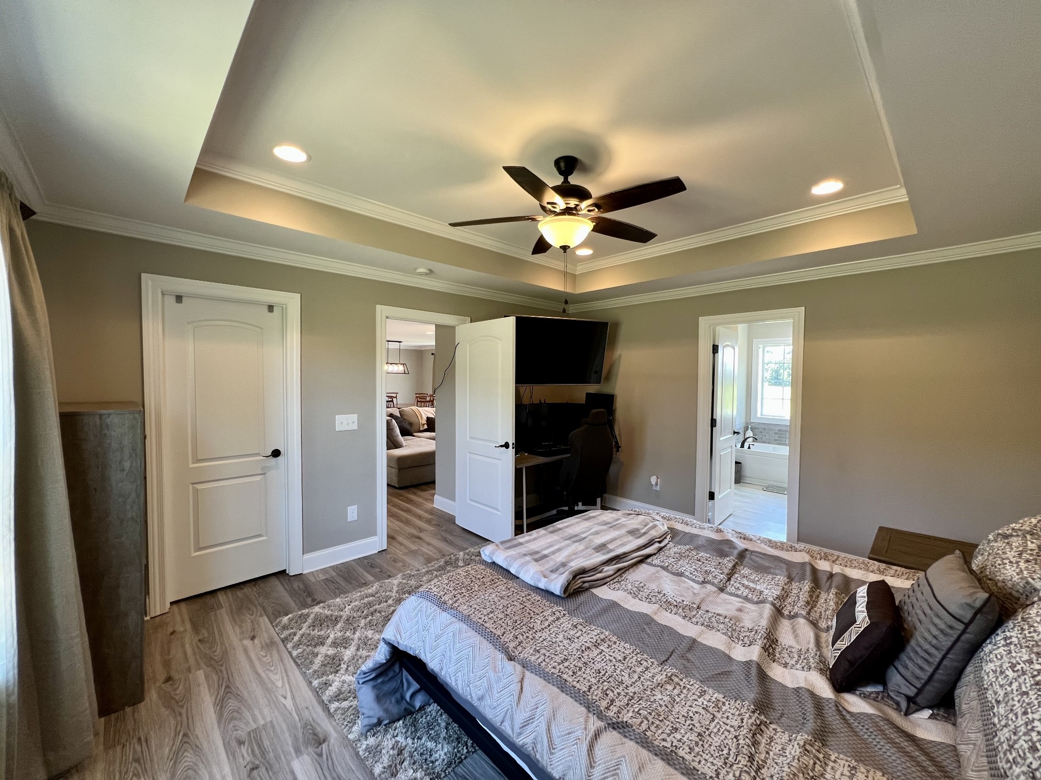 418 Taylor Road Manchester, TN 37355 - Photo 15 of 30 a spacious bedroom with a bed and a chandelier