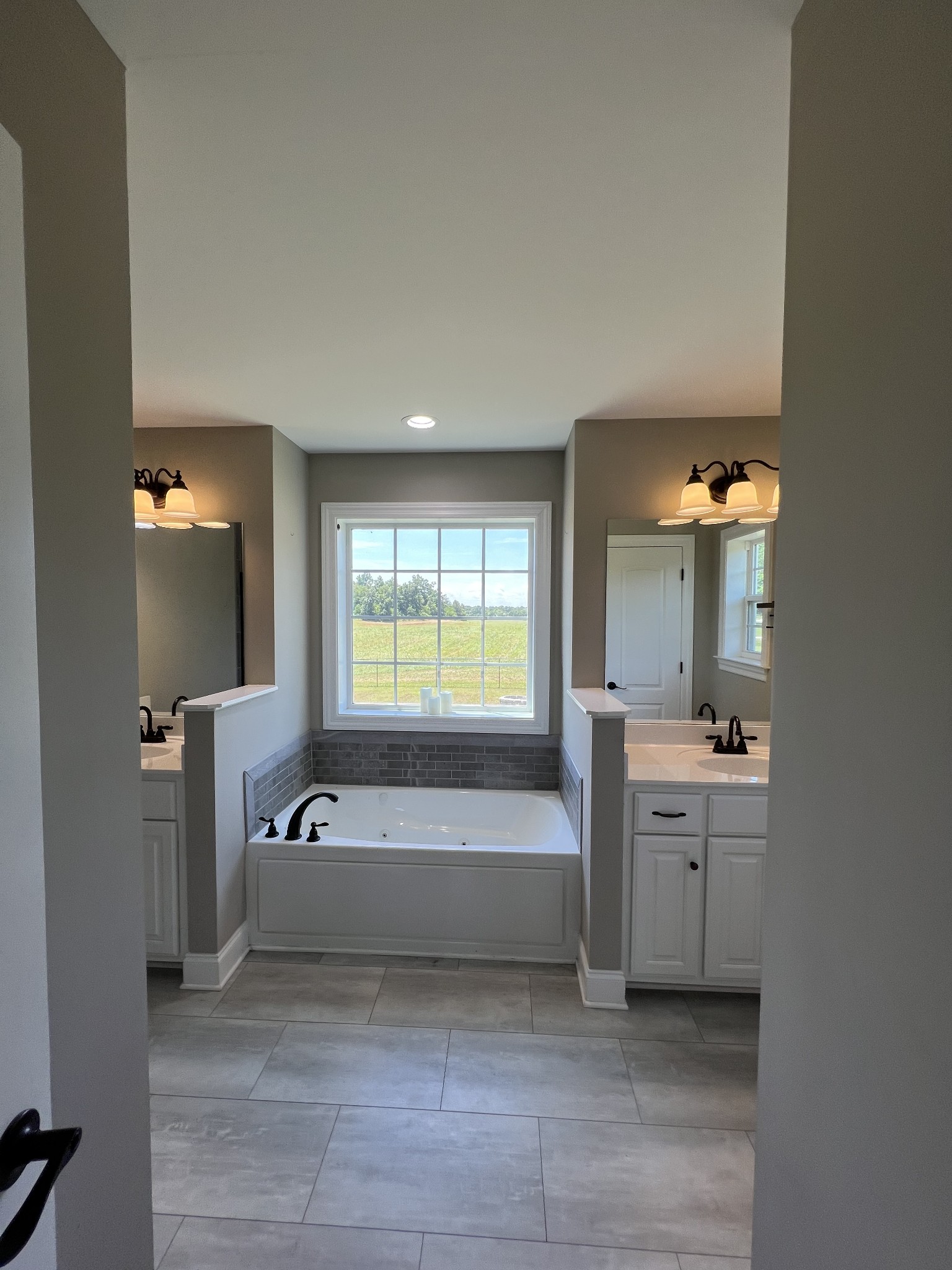 418 Taylor Road Manchester, TN 37355 - Photo 17 of 30 a spacious bathroom with a bathtub and a sink