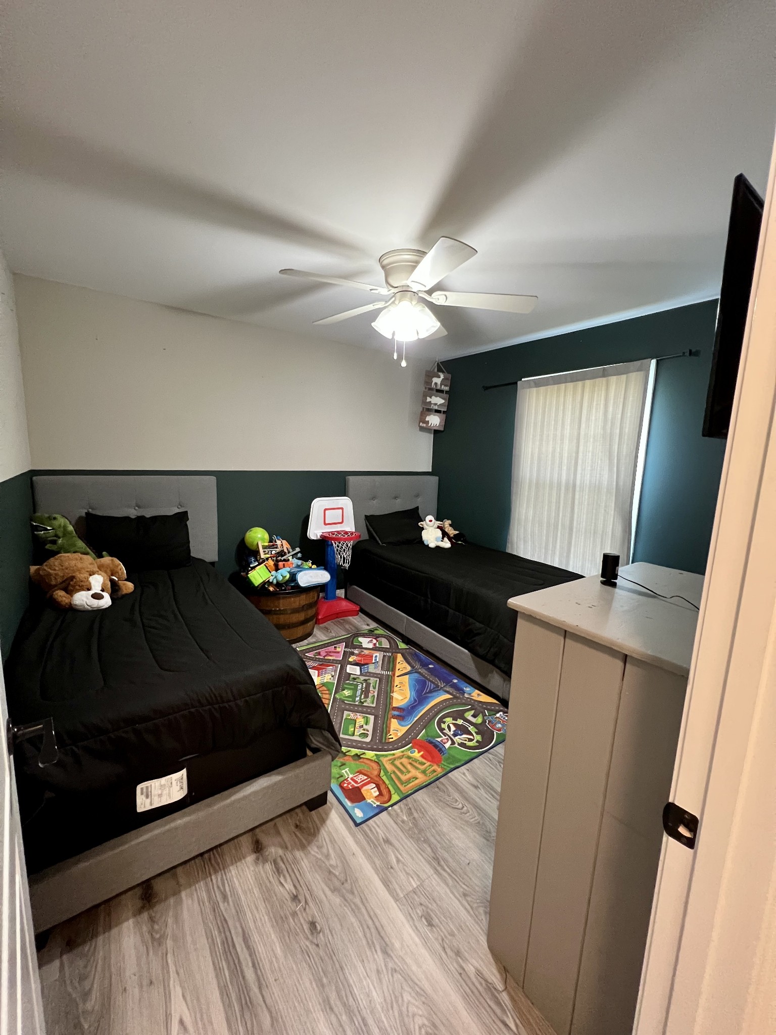 418 Taylor Road Manchester, TN 37355 - Photo 24 of 30 a bedroom with a bed and a chandelier