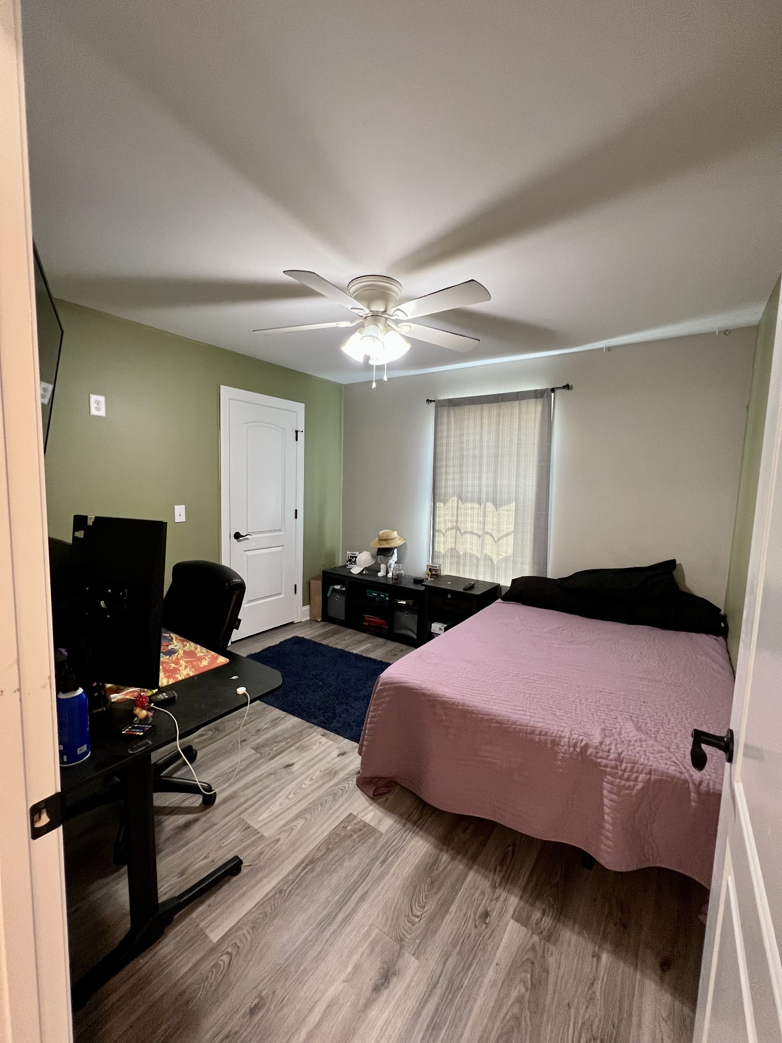 418 Taylor Road Manchester, TN 37355 - Photo 26 of 30 a bedroom with a bed and wooden floor