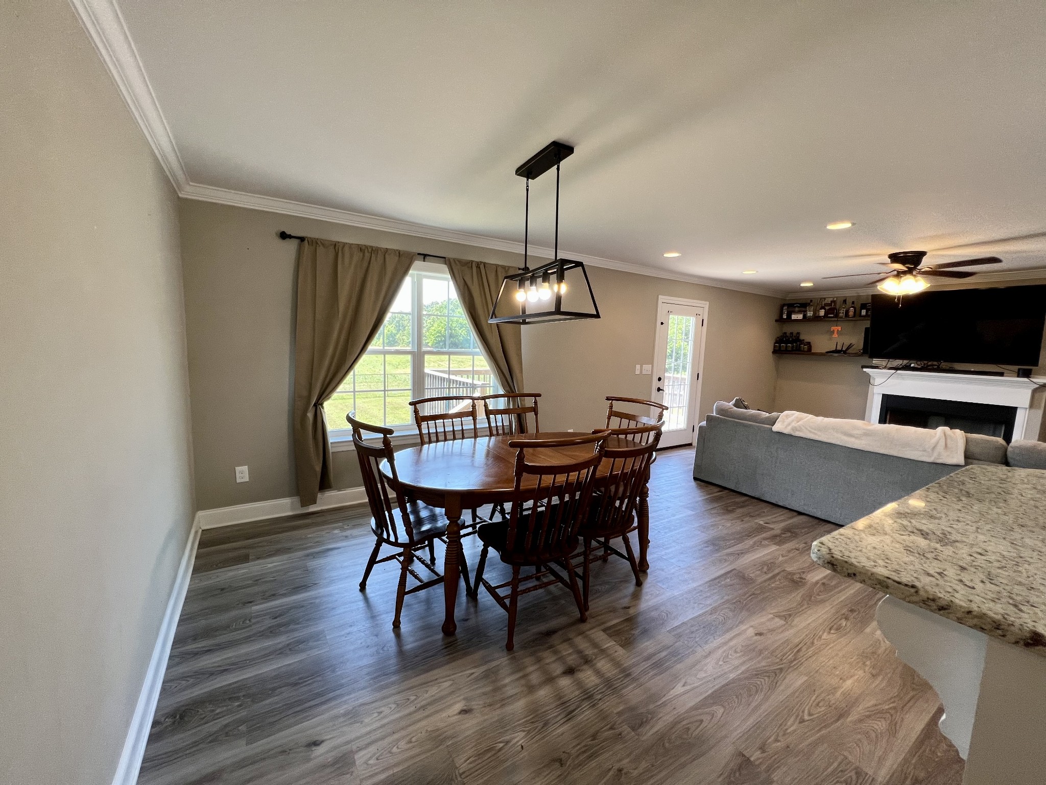 418 Taylor Road Manchester, TN 37355 - Photo 10 of 30 a view of a dining room with furniture and wooden floor