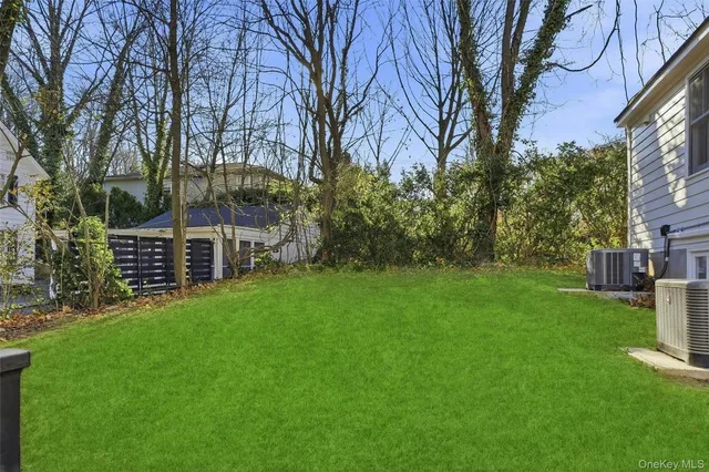 a view of a garden with a house