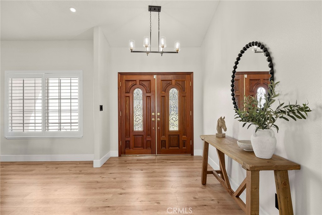 A gracious double-door front entry ushers you into the main living area