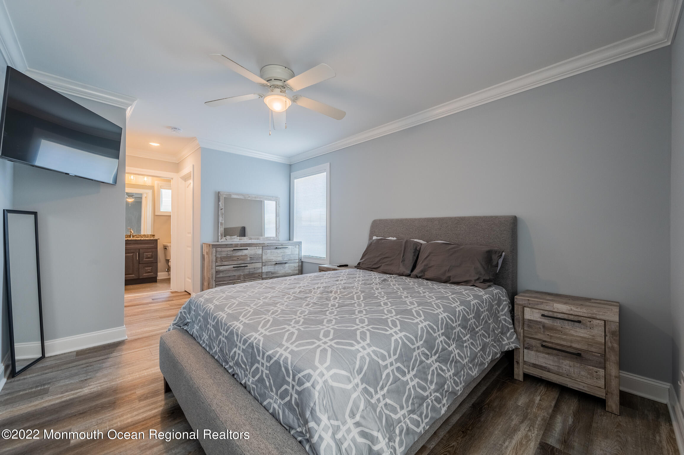 29 Fielder Avenue Seaside Heights, NJ 08751 - Photo 16 of 31 a bedroom with a bed and a chandelier