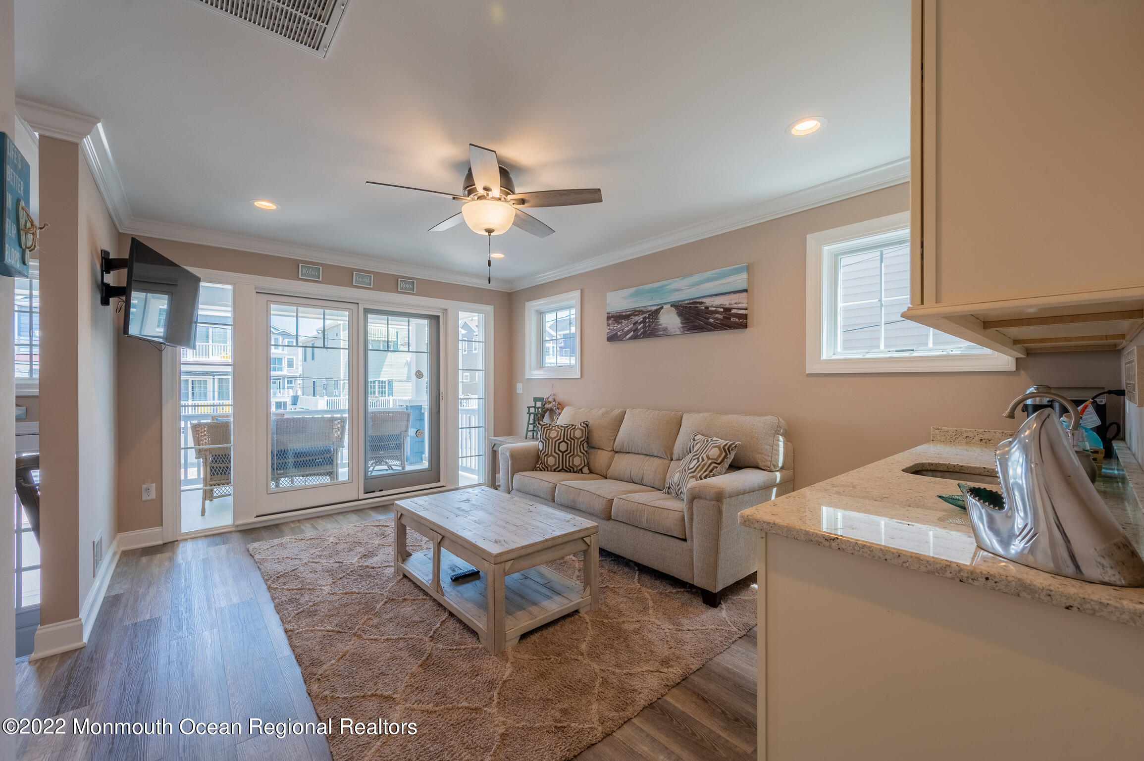 29 Fielder Avenue Seaside Heights, NJ 08751 - Photo 19 of 31 a living room with furniture and a floor to ceiling window