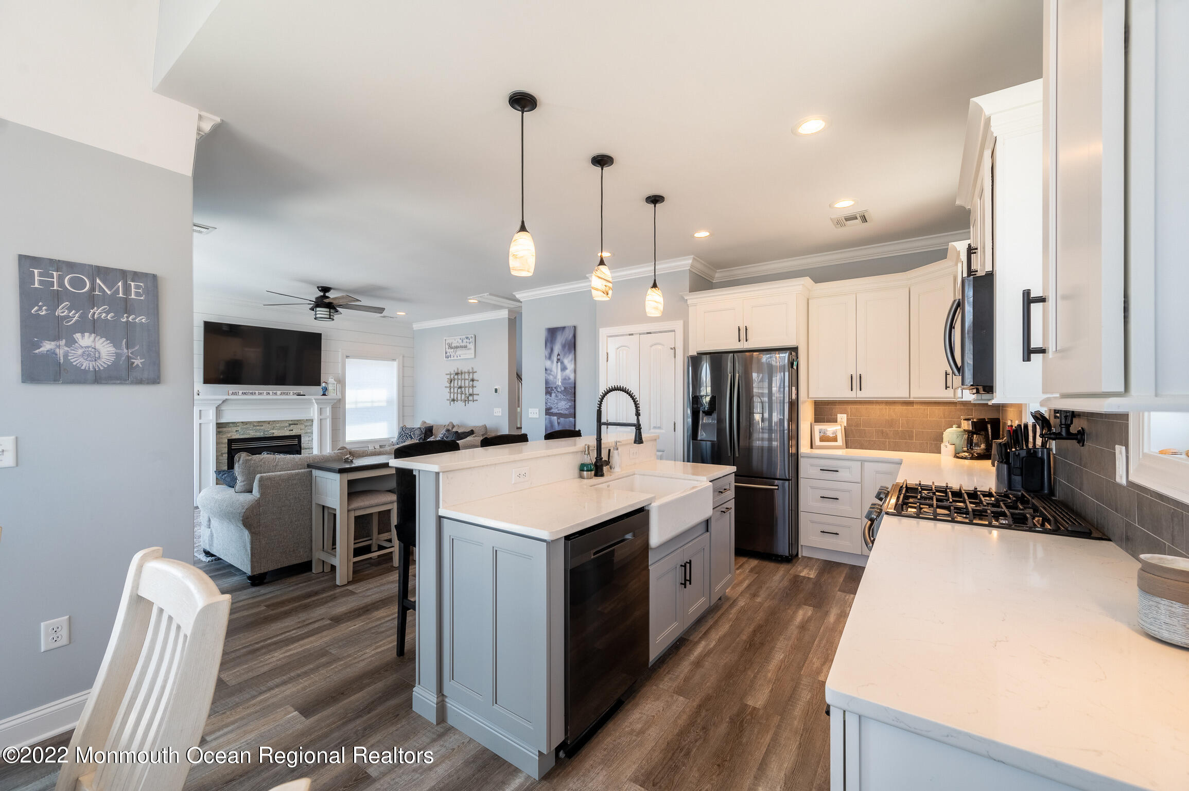 29 Fielder Avenue Seaside Heights, NJ 08751 - Photo 5 of 31 a large kitchen with stainless steel appliances a stove a sink dishwasher a refrigerator white cabinets and wooden floor