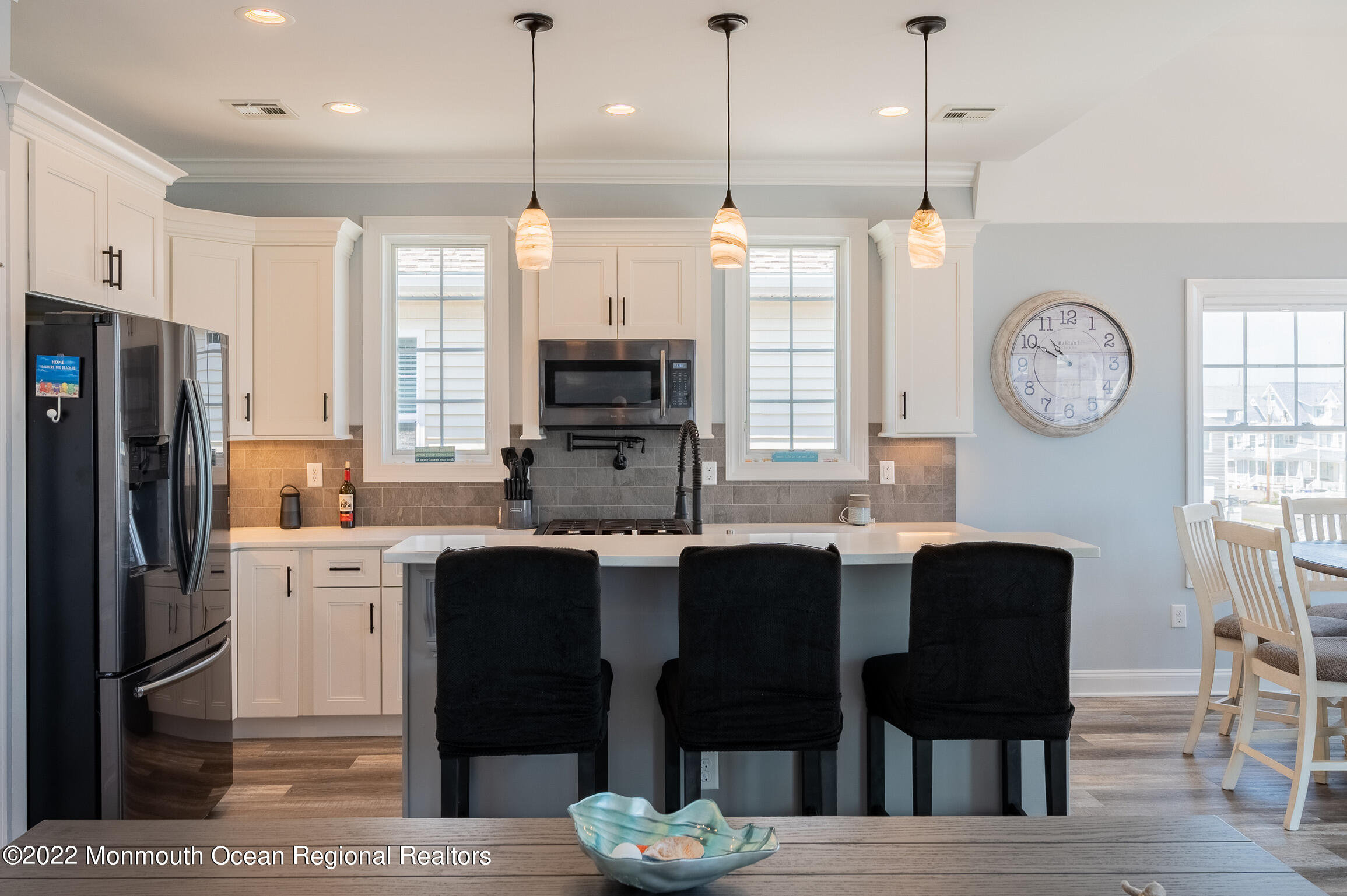 29 Fielder Avenue Seaside Heights, NJ 08751 - Photo 7 of 31 a kitchen with stainless steel appliances kitchen island granite countertop a refrigerator a stove a sink and a chairs