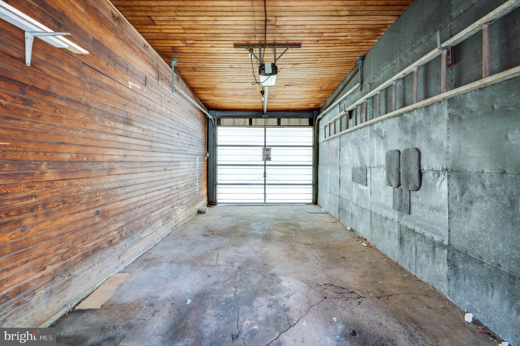 1448 Luzerne Street Reading, PA 19601 - Photo 29 of 32 Spacious garage with rustic charm.