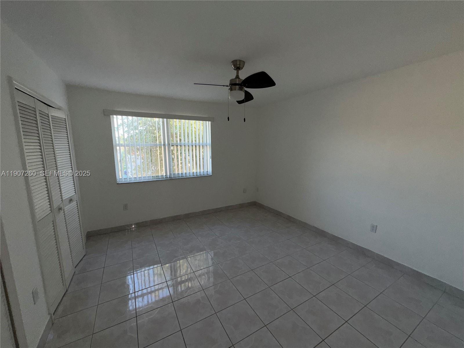 13855 Southwest 64th Street, Unit 13855 Miami, FL 33183 - Photo 24 of 31 an empty room with windows