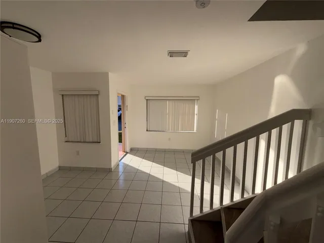 a kitchen with a refrigerator sink and microwave