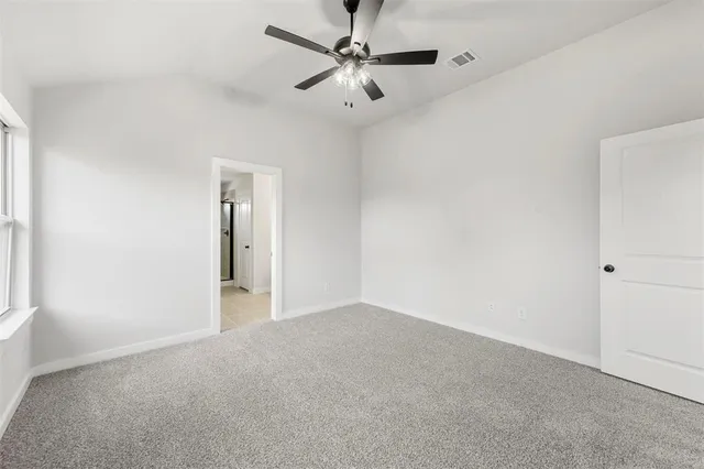 a view of a big room with carpet