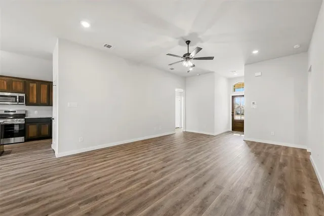 a view of a kitchen with a sink and a stove top oven