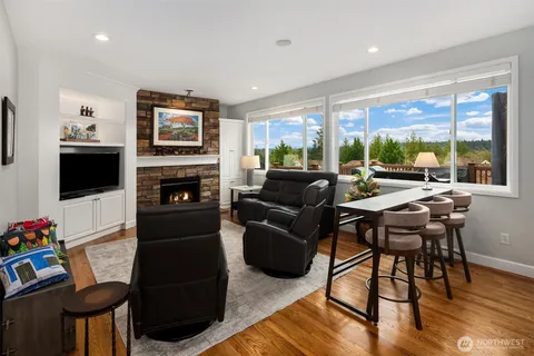 a bathroom with a granite countertop sink mirror and shower