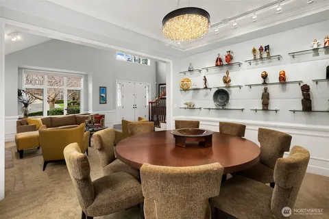 a living room with furniture a flat screen tv and a large window