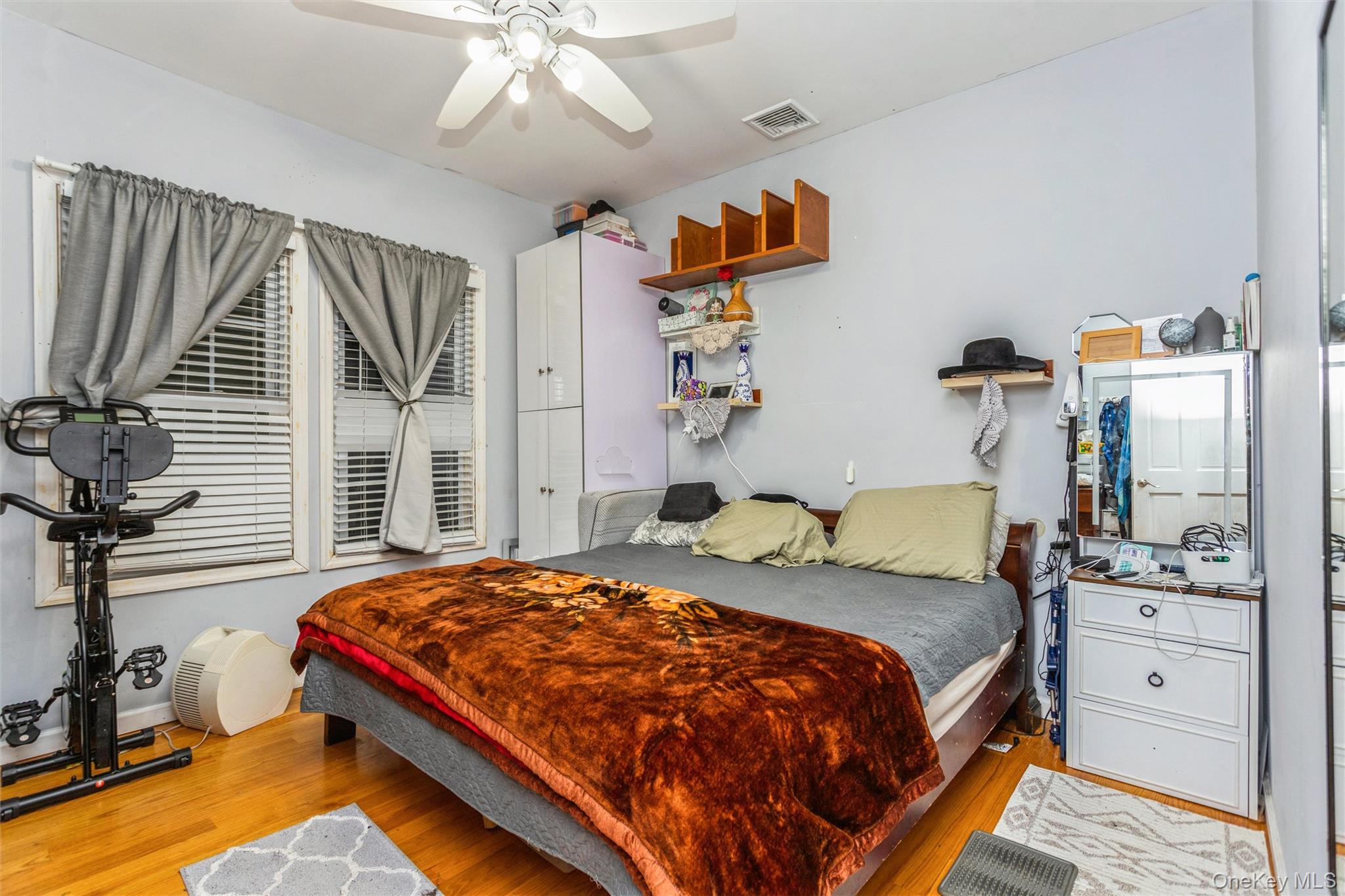 327 North 7th Avenue Mount Vernon, NY 10550 - Photo 24 of 32 a bedroom with a bed and a chandelier