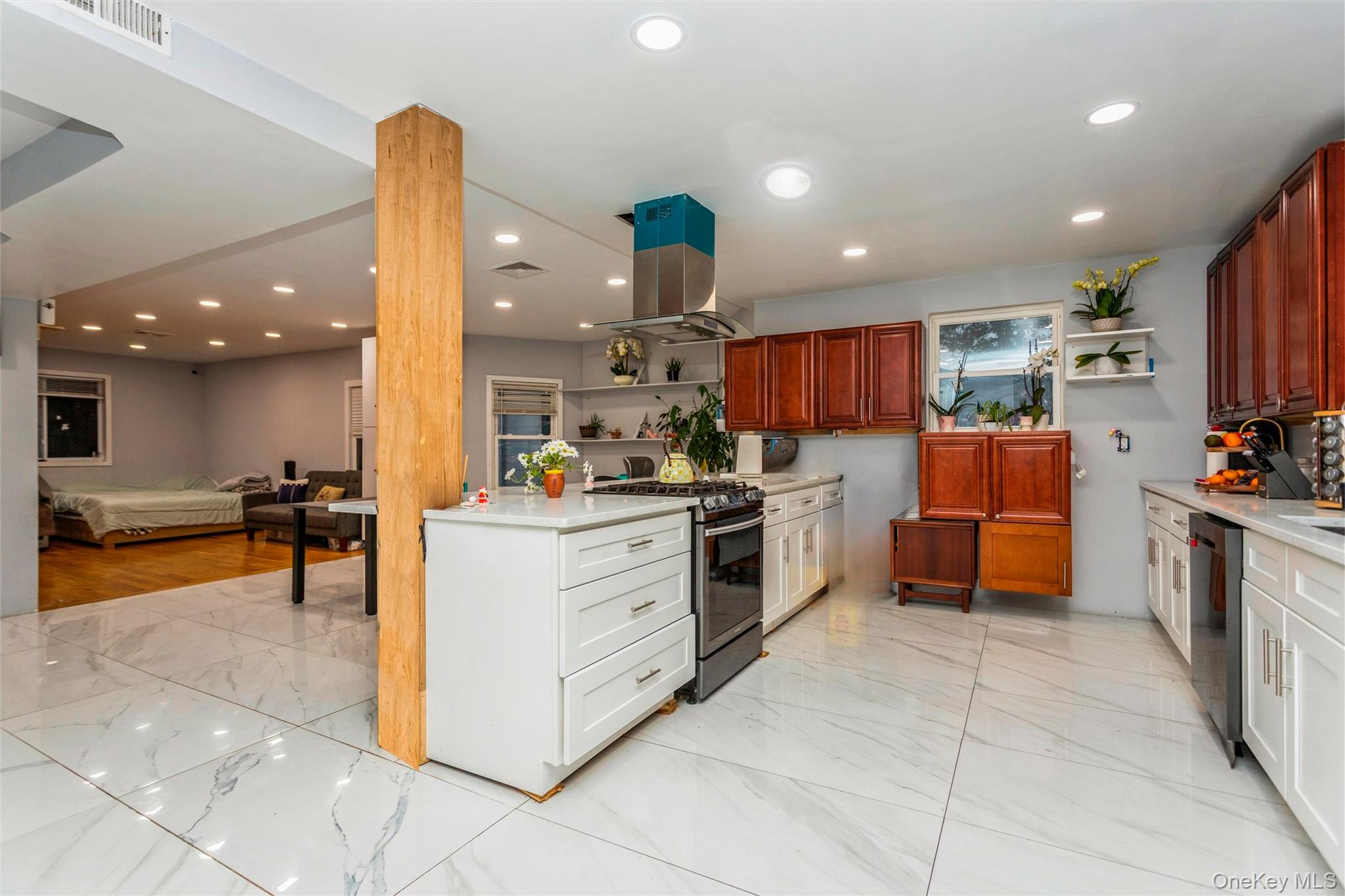 327 North 7th Avenue Mount Vernon, NY 10550 - Photo 5 of 32 a kitchen with stainless steel appliances kitchen island granite countertop a sink and cabinets