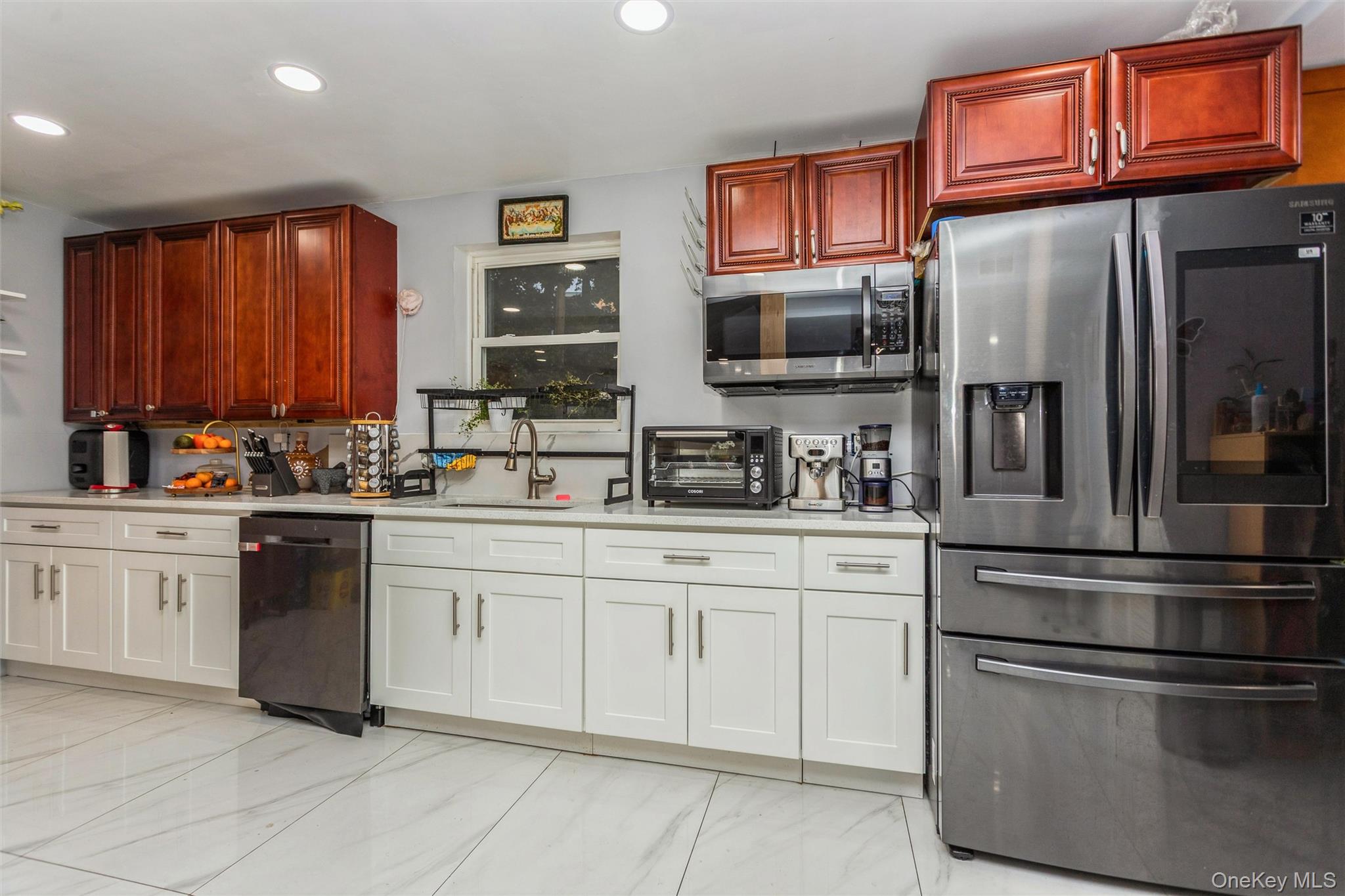 327 North 7th Avenue Mount Vernon, NY 10550 - Photo 8 of 32 a kitchen with stainless steel appliances granite countertop a refrigerator and microwave